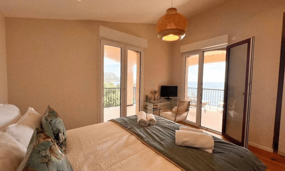 Luxurious bedroom suite with sea-facing balcony